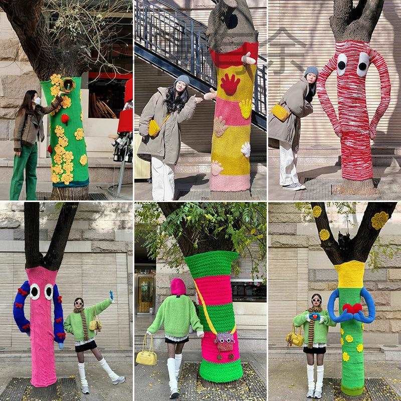 Winter outdoor sweater tree decoration, trendy tree with yarn wrapped around it, perfect for taking photos.