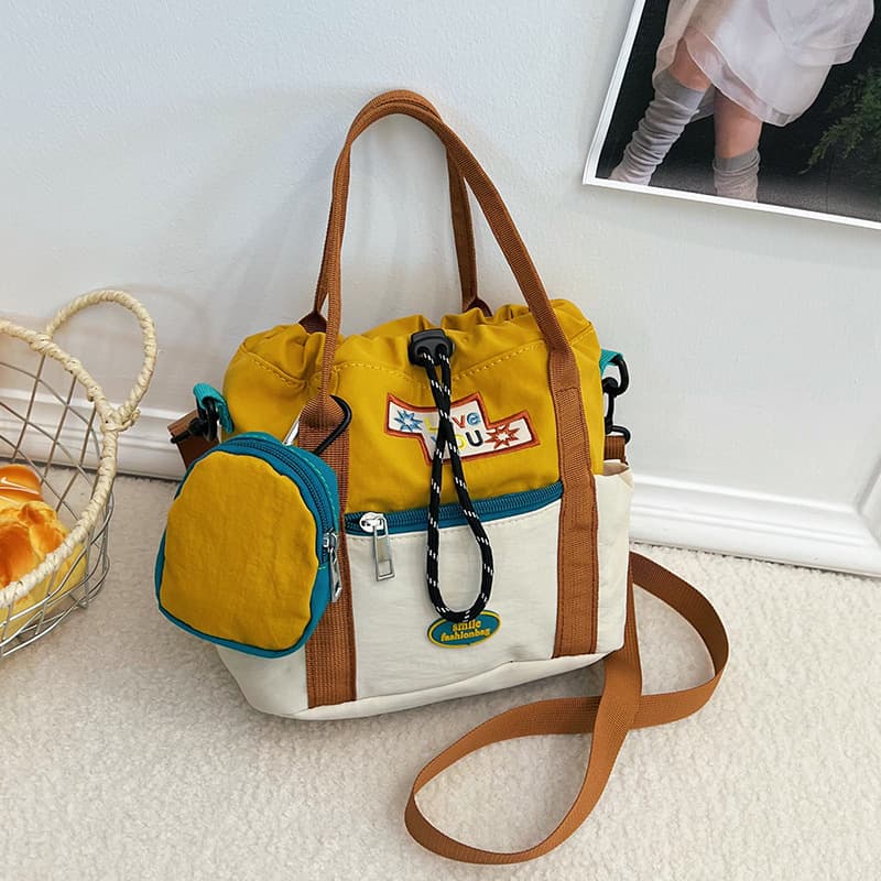 Cute crossbody bag for women 2026 new Korean style color matching bucket bag for girls large capacity student portable shoulder bag trendy