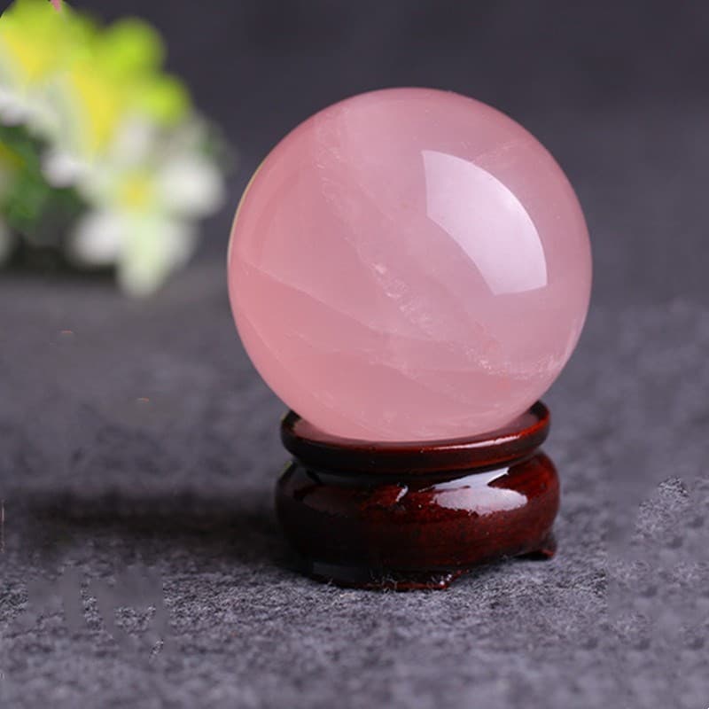 Wholesale supply of natural rose quartz crystal ball ornaments for home, living room, and bedroom use; raw stone polishing.