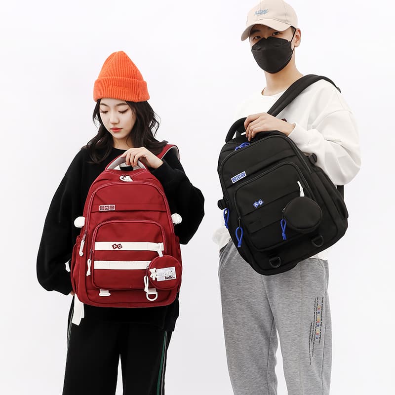 New nylon fashionable schoolbags for primary school students, spine protection and burden-reducing backpacks for men and women, trendy backpacks for grades three to six