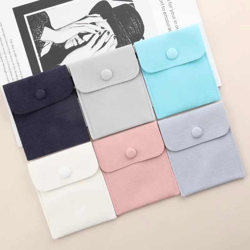 Ultra-fiber snap button flip-top bags for earrings, bracelets, necklaces, earphone accessory storage bags, customizable sizes and logos for wholesale.