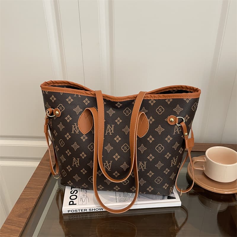 High-end women's bag 2025 autumn and winter new portable old flower tote bag niche design large capacity commuter shoulder bag