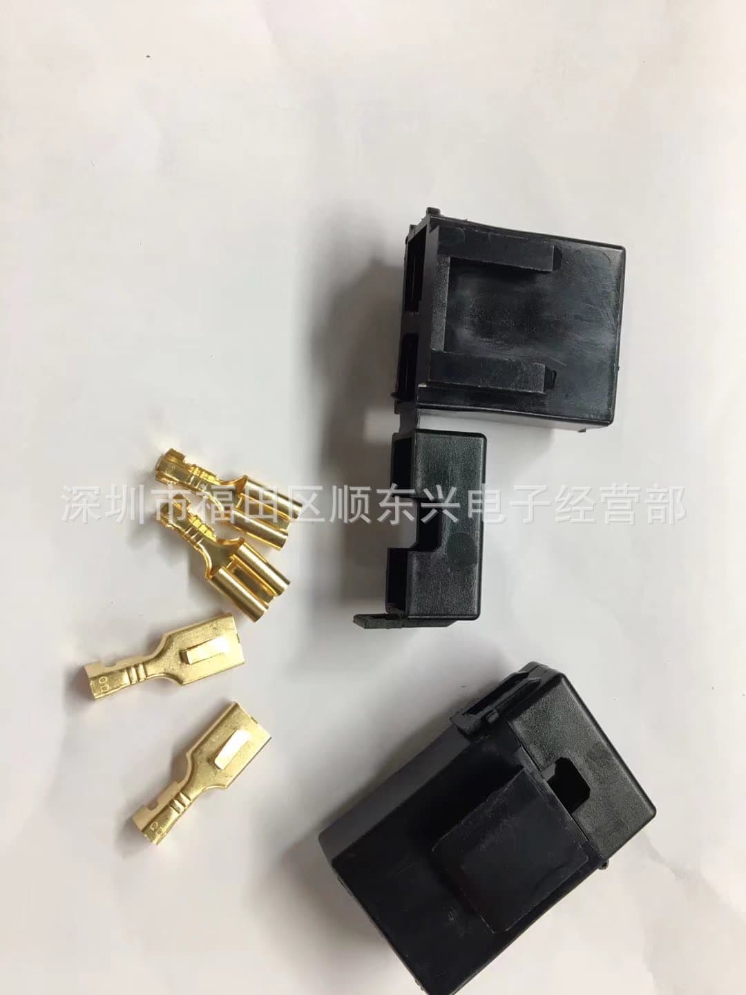 Black lighter case, fuse holder, medium-sized fuse box with lid.
