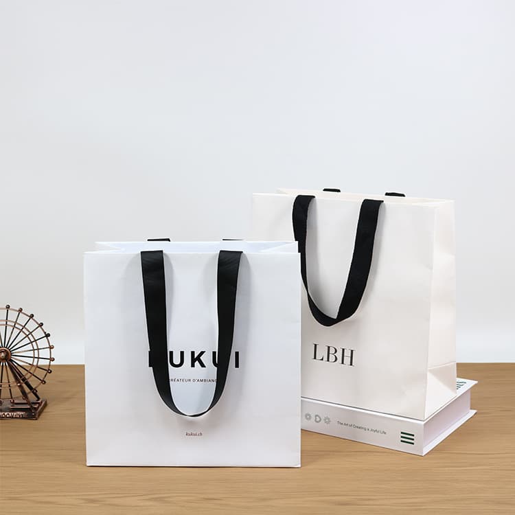 Hot-selling laminated art paper gift bags with your own logo gift design paper bags