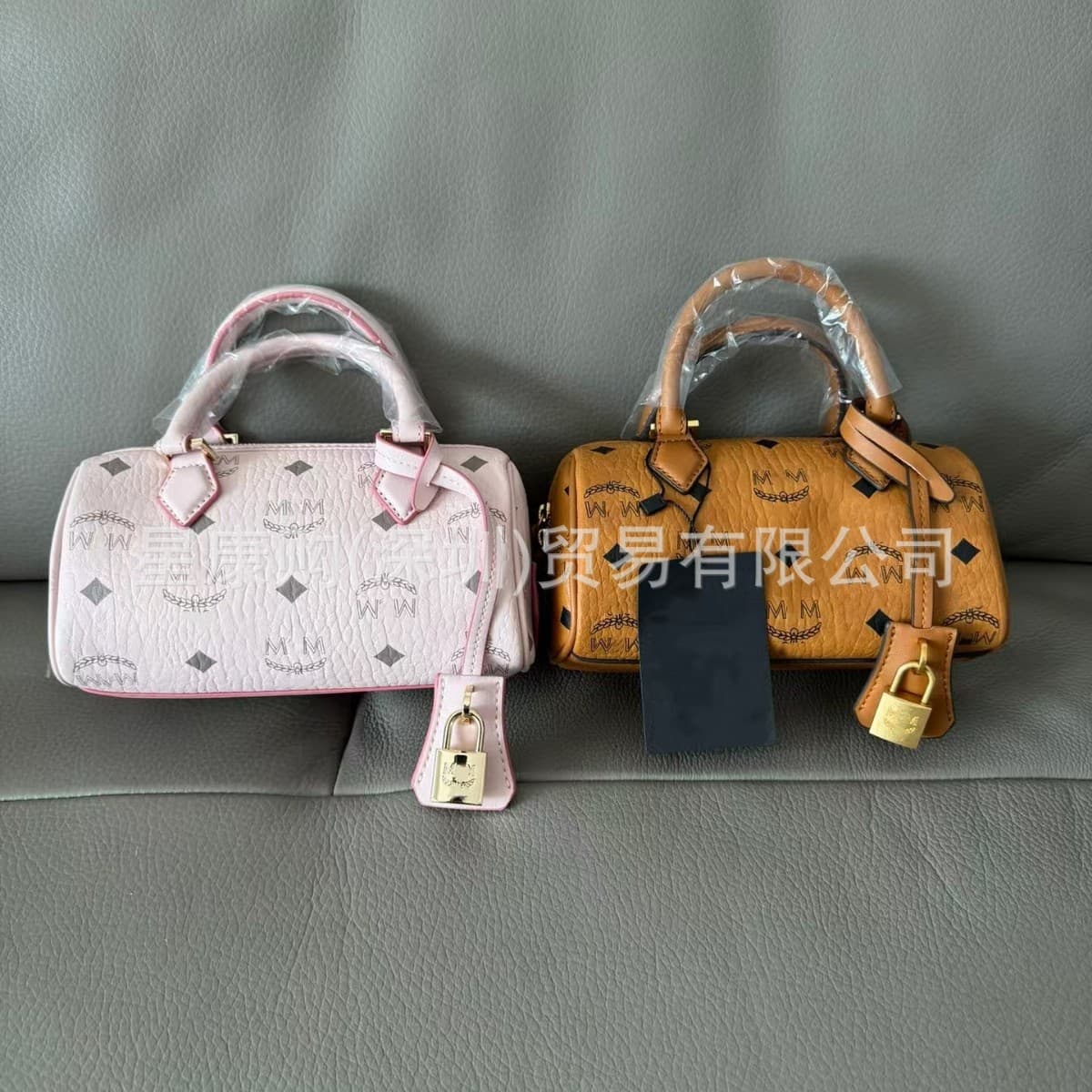 New High-Version MC Classic Mini Printed Gold Lock Bag Boston Pillow Shoulder Crossbody Commuter Fashion