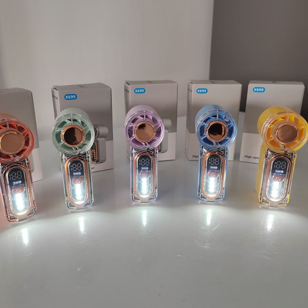 The popular X699 mini handheld fan USB rechargeable LED light long-lasting turbo violent small fan