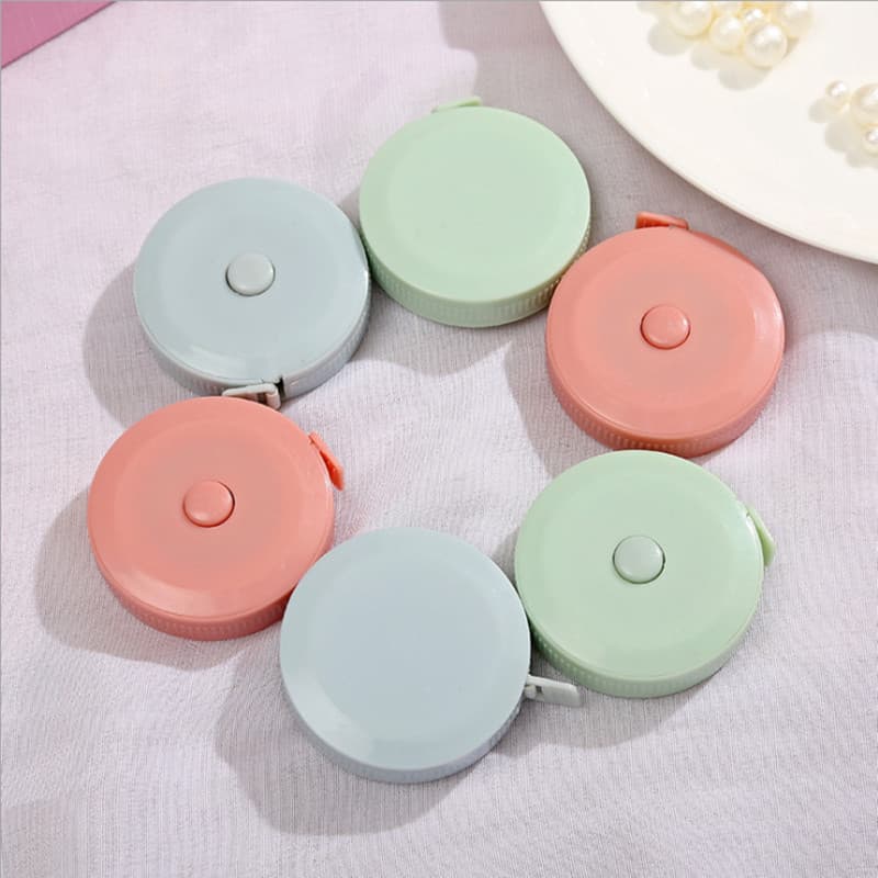 Retractable tape measure 1.5m soft tape, portable plastic multifunctional cute mini round tape measure.