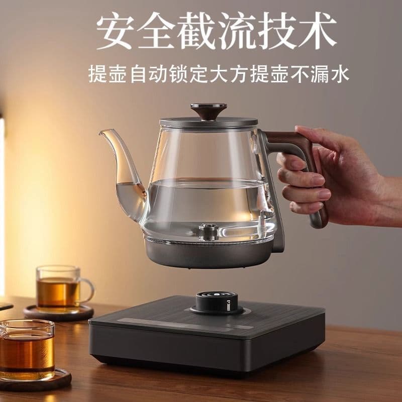 Automatic handle water-filling electric kettle, tea brewing pot, home thickened glass water pumping tea table integrated electric tea stove factory.