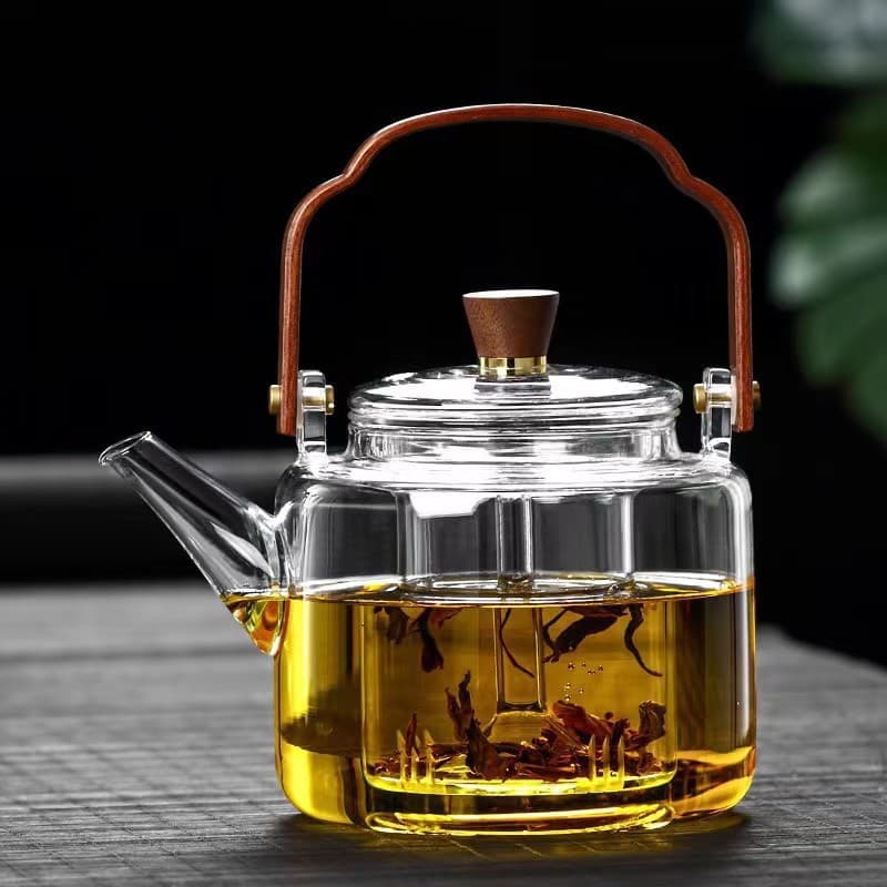 Teapot with high temperature resistance, made of glass, suitable for home use, with handle, for boiling water and brewing tea. Electric ceramic stove tea maker and tea set.
