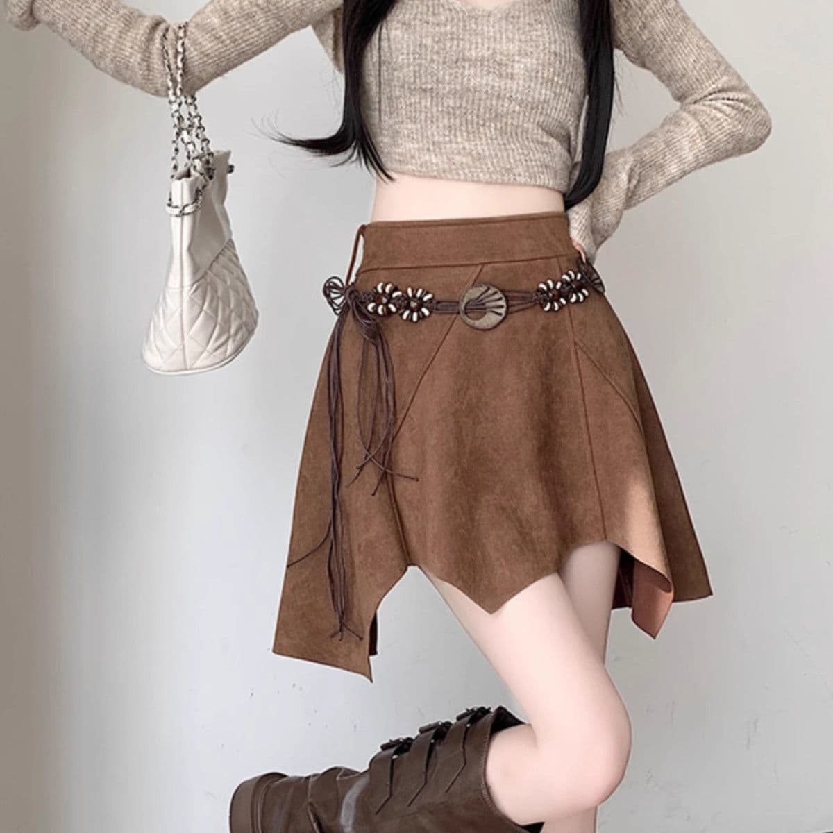 Plus-size irregular suede midi skirt for women, perfect for autumn and winter, slimming and flattering, retro and sexy style.