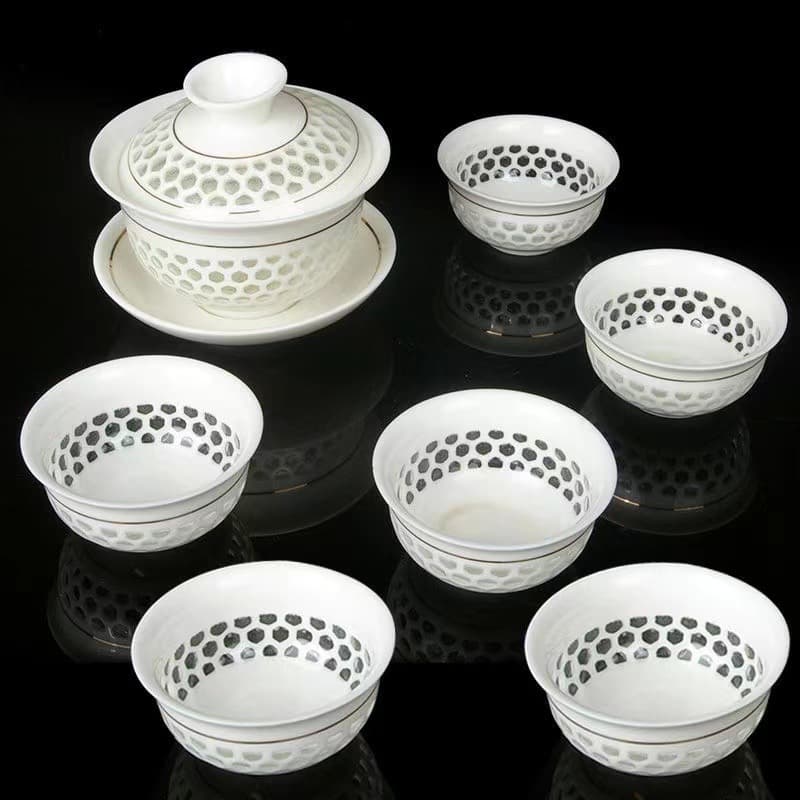 Honeycomb-shaped hollowed-out tea set, tea bowl, white porcelain Chaoshan Kung Fu tea set, three-piece covered bowl, creative tea set cup.