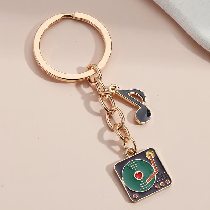 Cross-border hot selling new note disc gramophone keychain piano violin note pendant pendant manufacturer wholesale