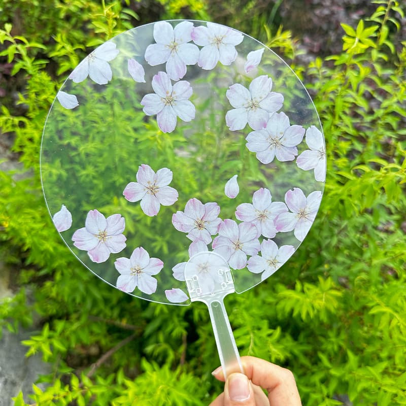 Portable fan, student hand-cranked transparent fan, advertising-style fresh summer cartoon fan, transparent student flower PVC fan.