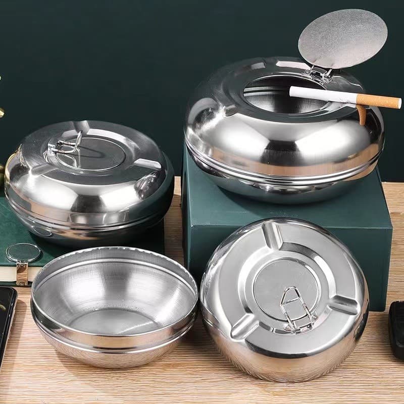 Creative and personalized large stainless steel ashtray with flip-top and automatic extinguishing mechanism for living room, dining room, and office.