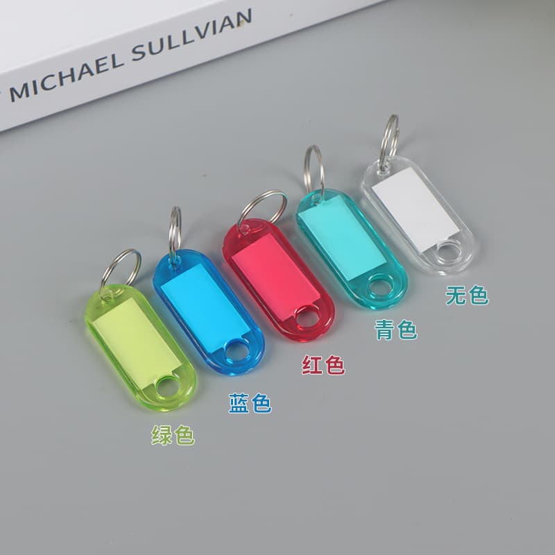 Colorful transparent plastic writable marking number tags for key classification, luggage tags, and hotel keychains.