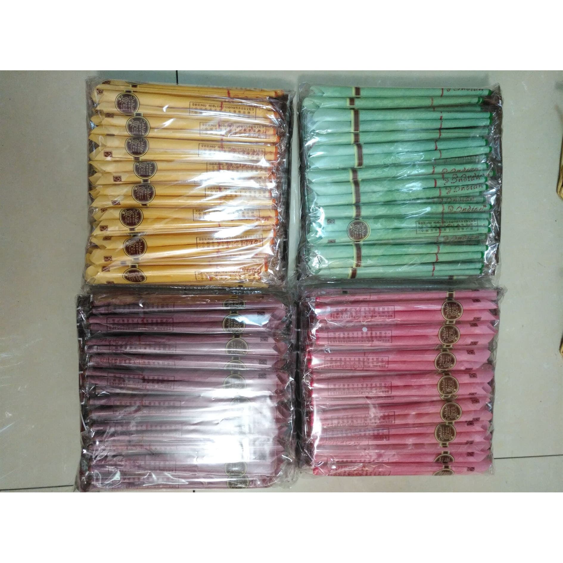 Indian-style scented trumpet-shaped ear candles with plugs; cone-shaped scented navel candles with plugs; 8 colors, 8 scents.