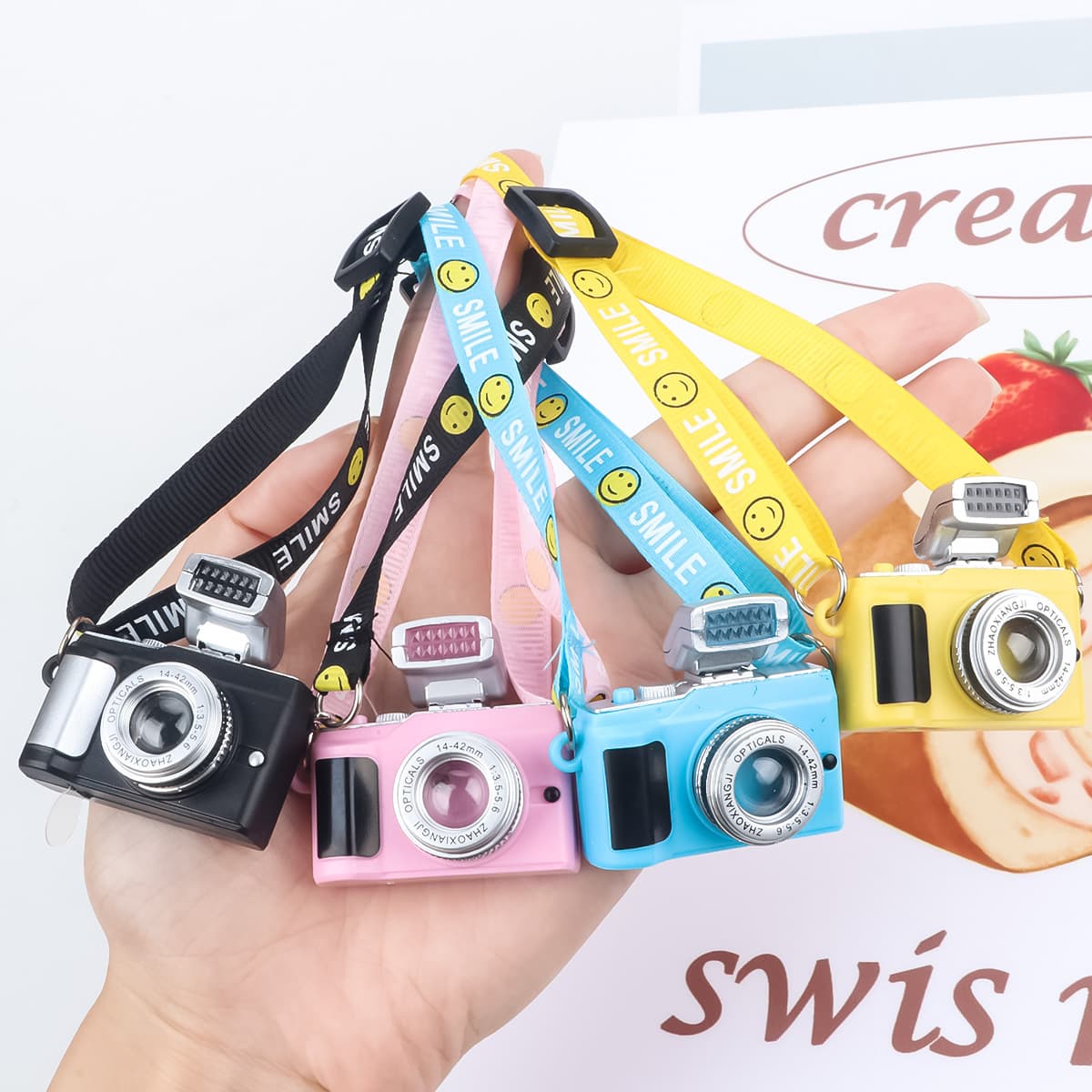 Cotton doll smiling face strap webbing light-emitting sound camera pendant master dog simulation mini camera backpack