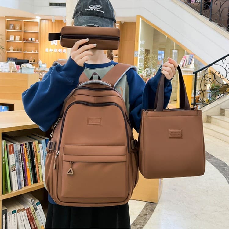Japanese solid color simple multi-layer casual backpack 2026 spring and summer new three-piece set for primary and secondary school students and high school students