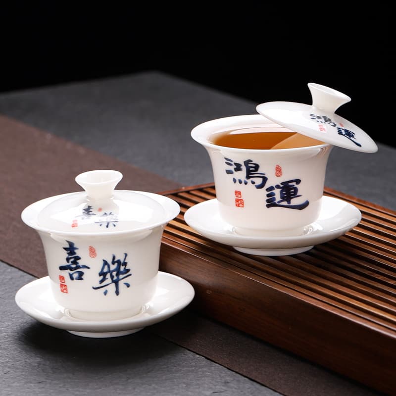 Hover Sancai covered bowl household Dehua mutton fat jade white porcelain Kung Fu tea set calligraphy single tea serving tea bowl wholesale