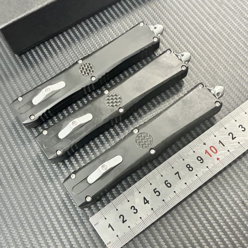 Cross-border supply of Dirac carbon fiber zinc alloy handle outdoor tools OTF multi-function EDC scabbard self-defense accessories