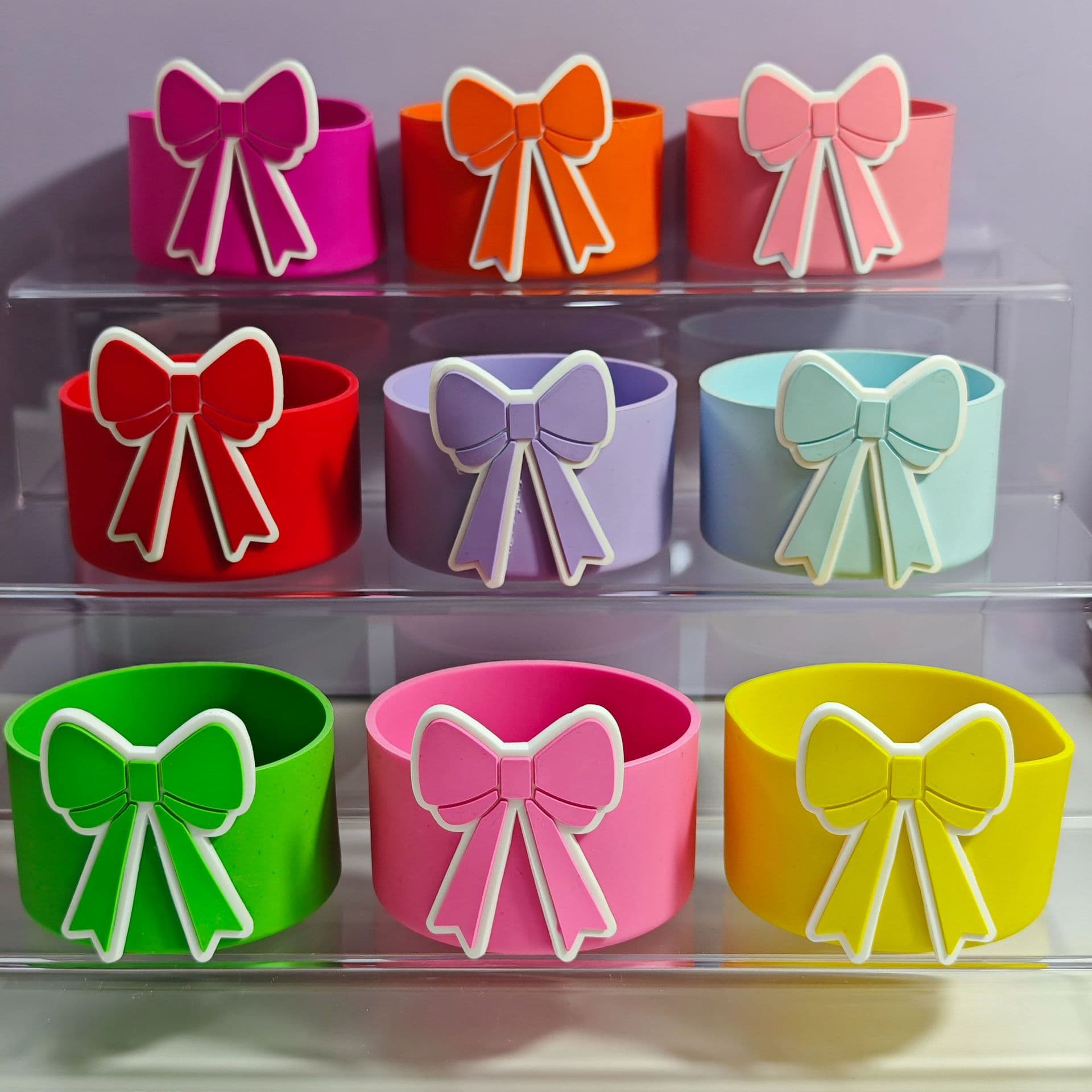 New silicone cup sleeve, approximately 7.5cm, with bow decoration. Stanley cup accessory, protective sleeve, coaster, and cup holder.