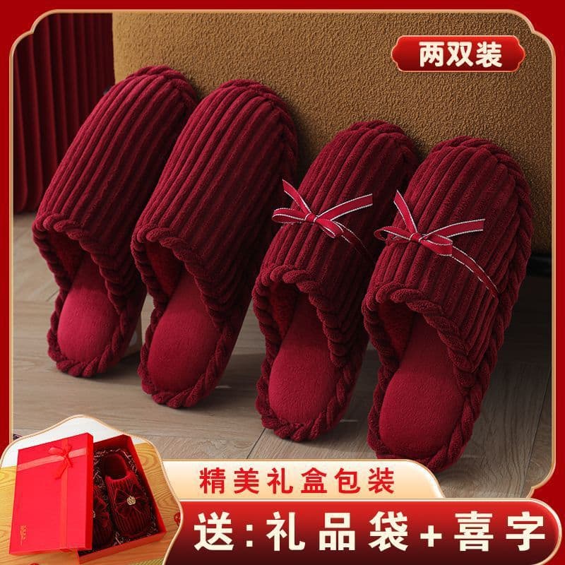 A pair of bright red wedding slippers for festive occasions, bride's dowry, indoor couple's zodiac year cotton slippers for autumn and winter.