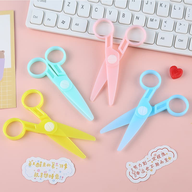 Macaron-colored transparent plastic children's rounded-tip craft scissors for kindergarten and elementary school safety paper cutting knives wholesale.