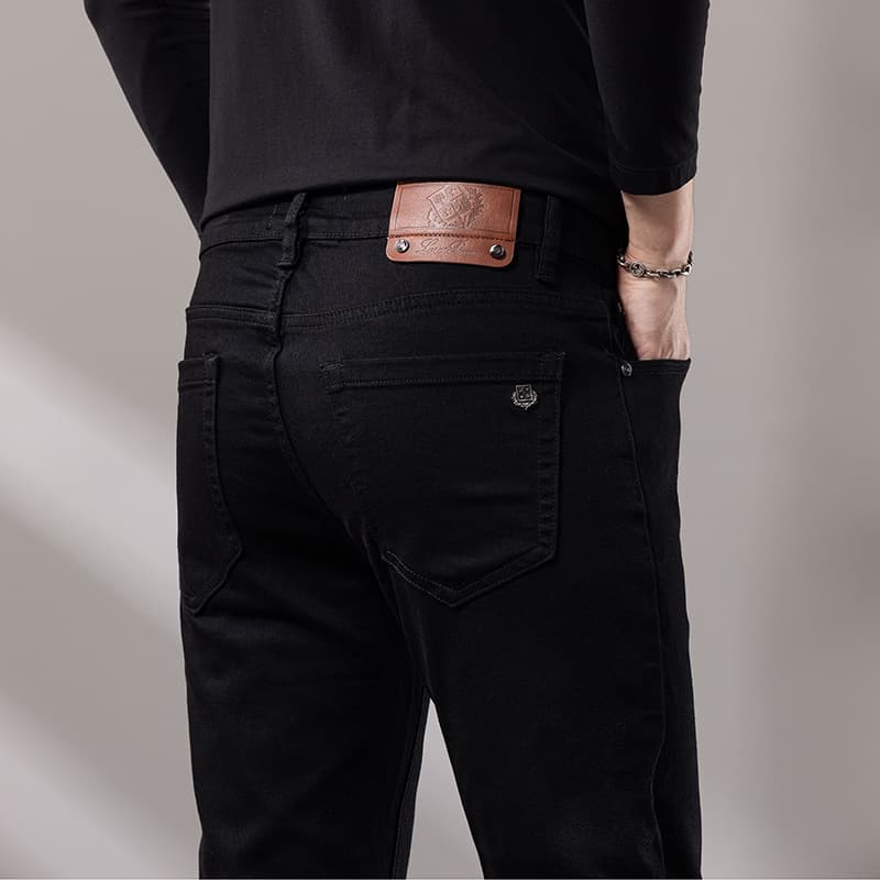Guangzhou Xintang brand men's cross-border jeans men's black stretch small straight high-end pants foreign trade original standard