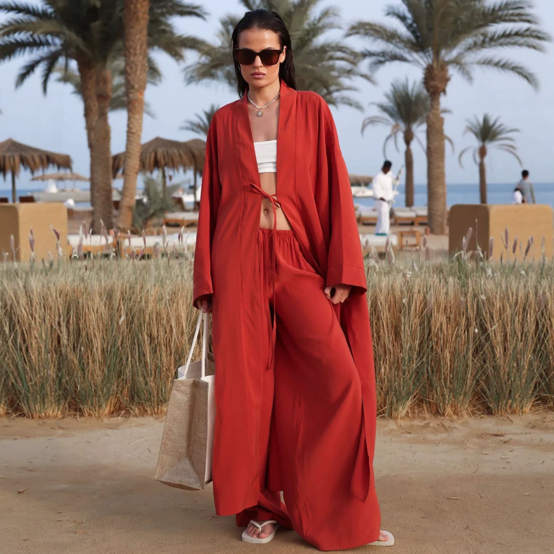 2026 new cross-border European and American holiday style solid color loose long lace-up cardigan lazy wide-leg pants two-piece set