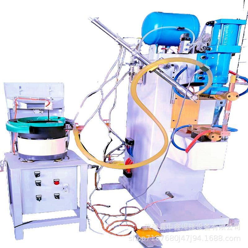 Automotive parts nut spot welder with automatic nut/screw feeder, high-power efficient capacitor energy storage welder.