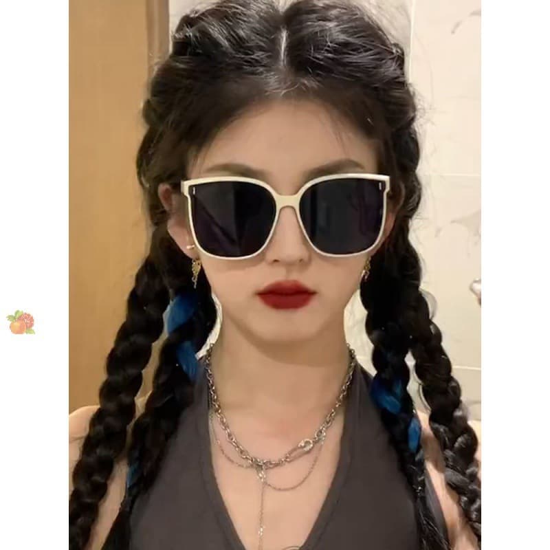 Foldable white-frame sunglasses for women, trendy street style with UV/glare protection
