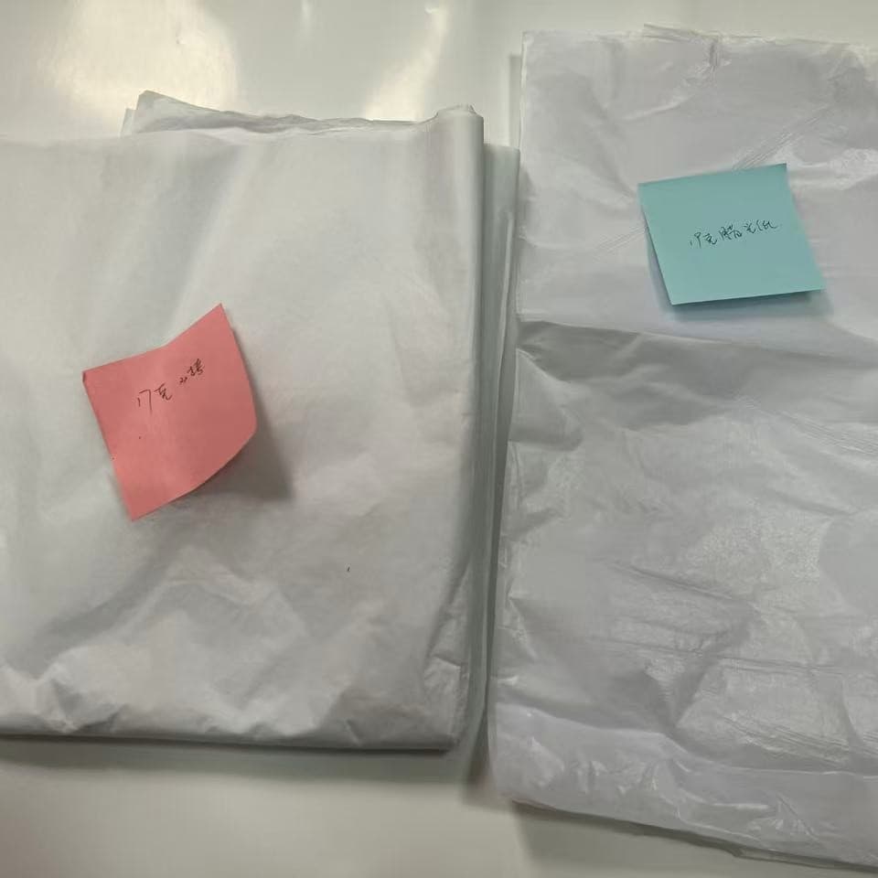 Semi-transparent glossy waxed paper, oil-resistant paper for trademark packaging, bulk discounts available.