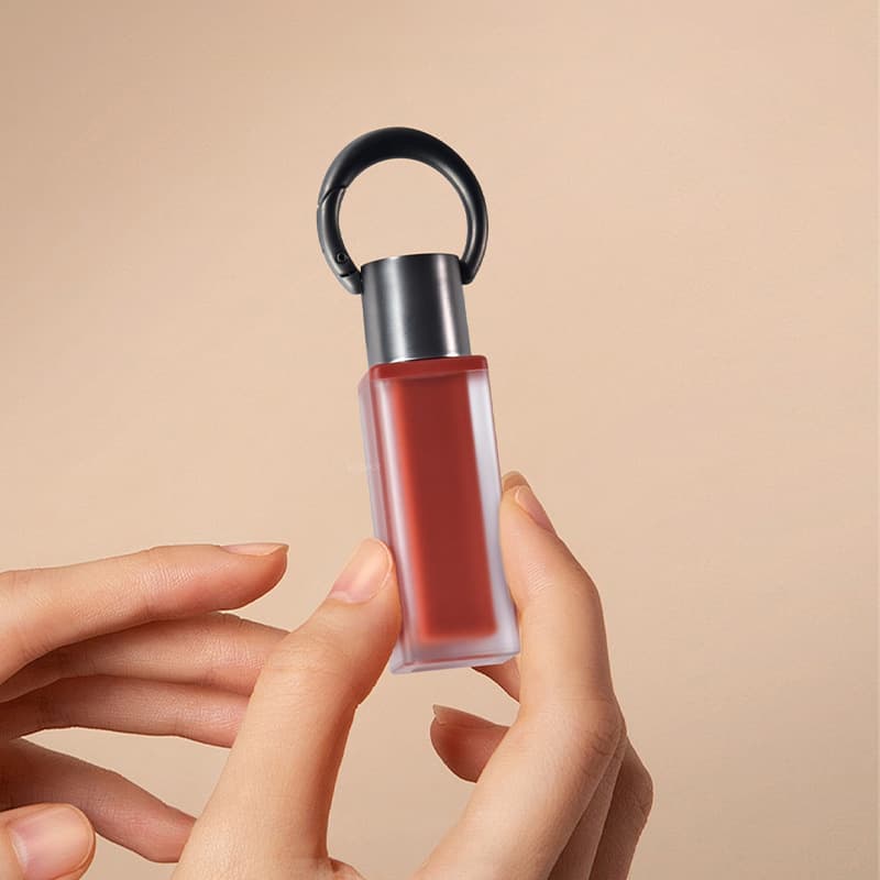 Custom color keychain lip gloss bottle for moisturizing lip fullness and glossy packaging, 3ml lip balm tube keychain.