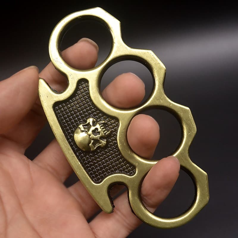 Cross-border skull, four-finger hand buckle, tiger ring, legal martial arts training bracelet, vehicle-mounted defense tool