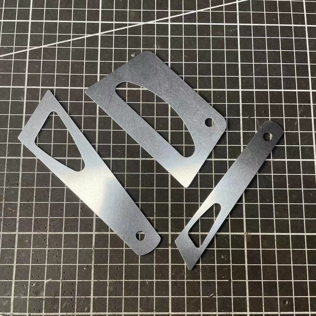 Stainless steel leather scraping blade.