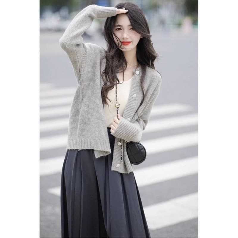 A stylish and sophisticated two-piece autumn outfit featuring a chic, minimalist, and flattering dress that's perfect for those with a slightly fuller figure.
