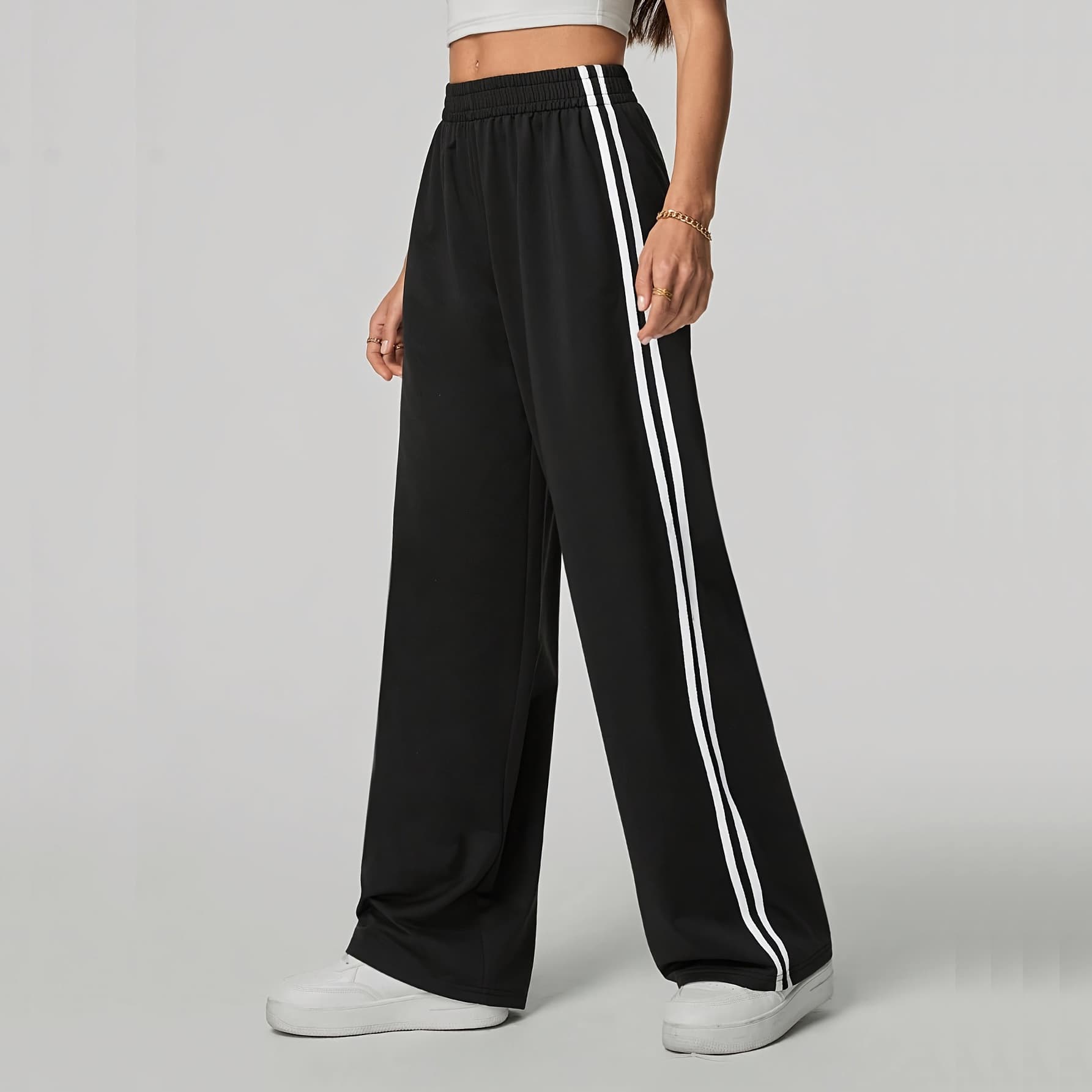 Women's straight-leg sweatpants, black with white side stripes, suitable for gym workouts, running, and everyday casual wear.
