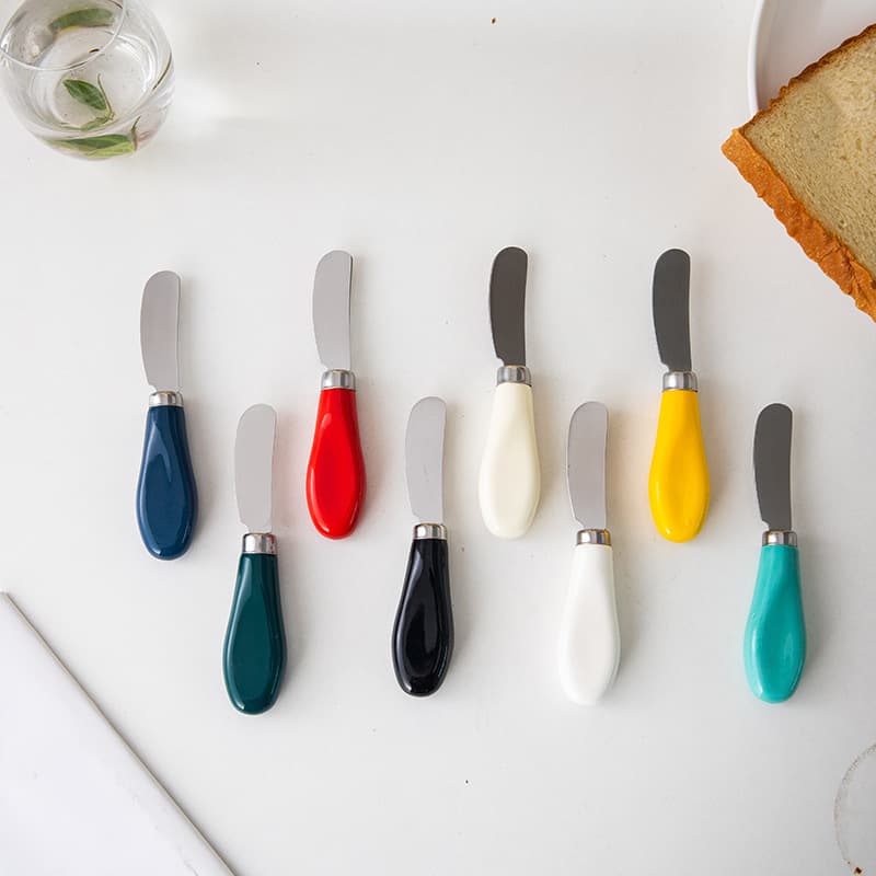Cross-border stainless steel cheese and butter knife with ceramic handle, multi-functional spreader for cheese, jam, cream, and peanut butter.