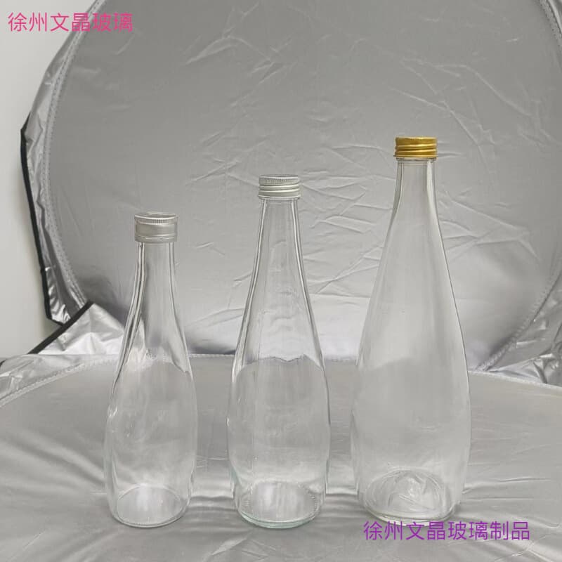 Supply 750ml 330ml500ml Evian mineral water glass bottle beverage bottle wine bottle aluminum cap fruit wine bottle