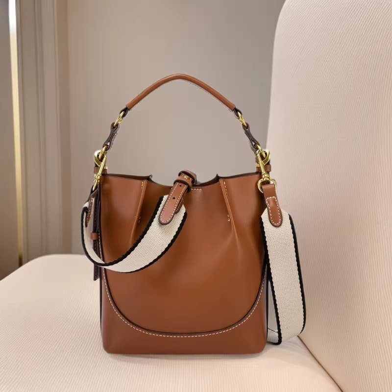 Spain 2026 New Women's Bag Brown Pleated Drawstring Versatile Handheld Bucket Bag Wide Shoulder Strap Crossbody Bag
