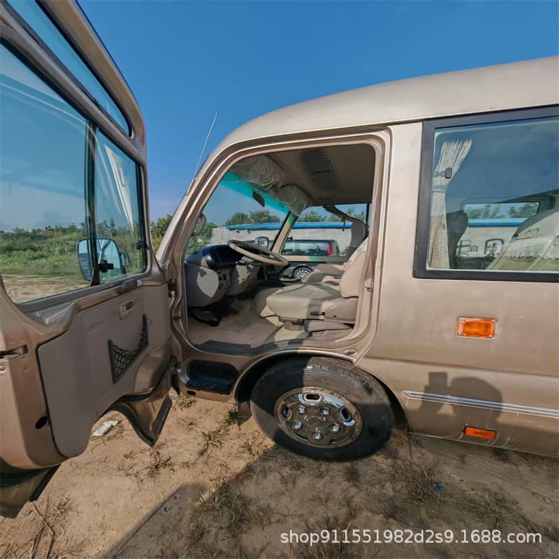 Used Toyota Coaster minibuses with 26 seats, equipped with Euro III emission standard engines, undergoing refurbishment and remanufacturing.