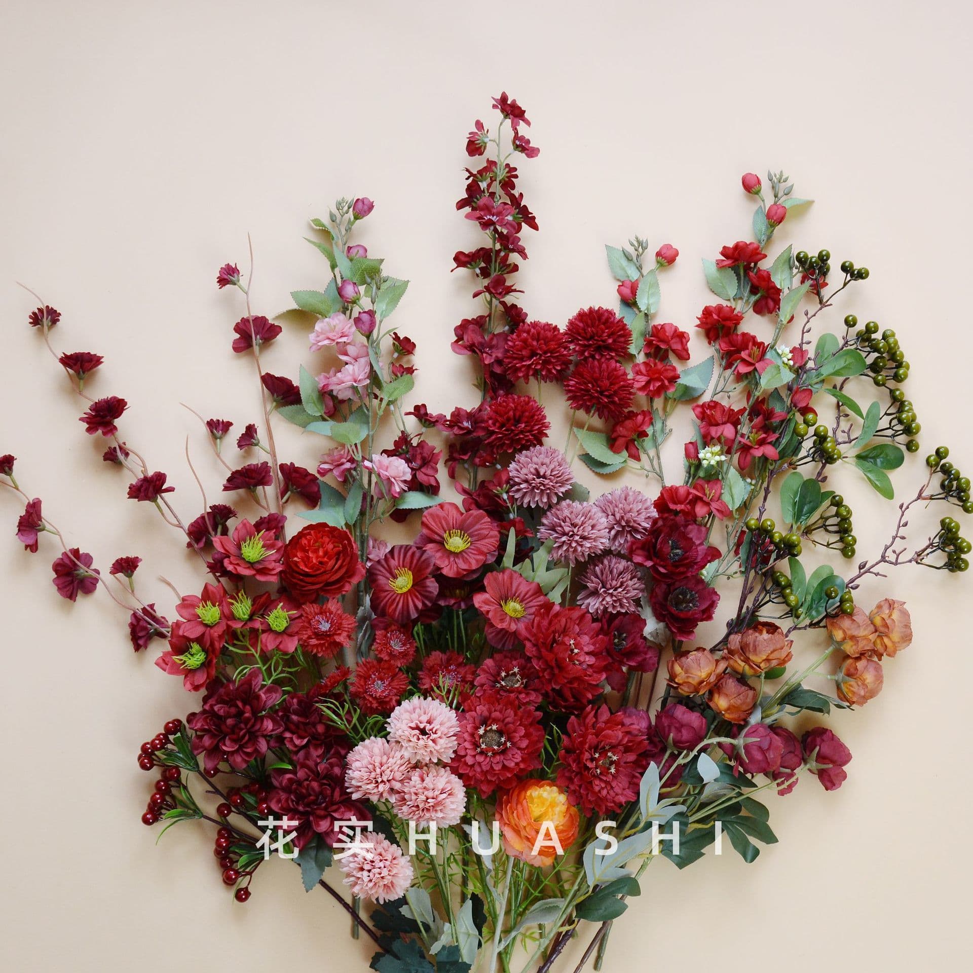 Ins-style red wedding venue decoration with artificial flowers, wedding aisle guide flower arrangements, floor arrangements, ceiling hanging silk flowers, and dried fruits
