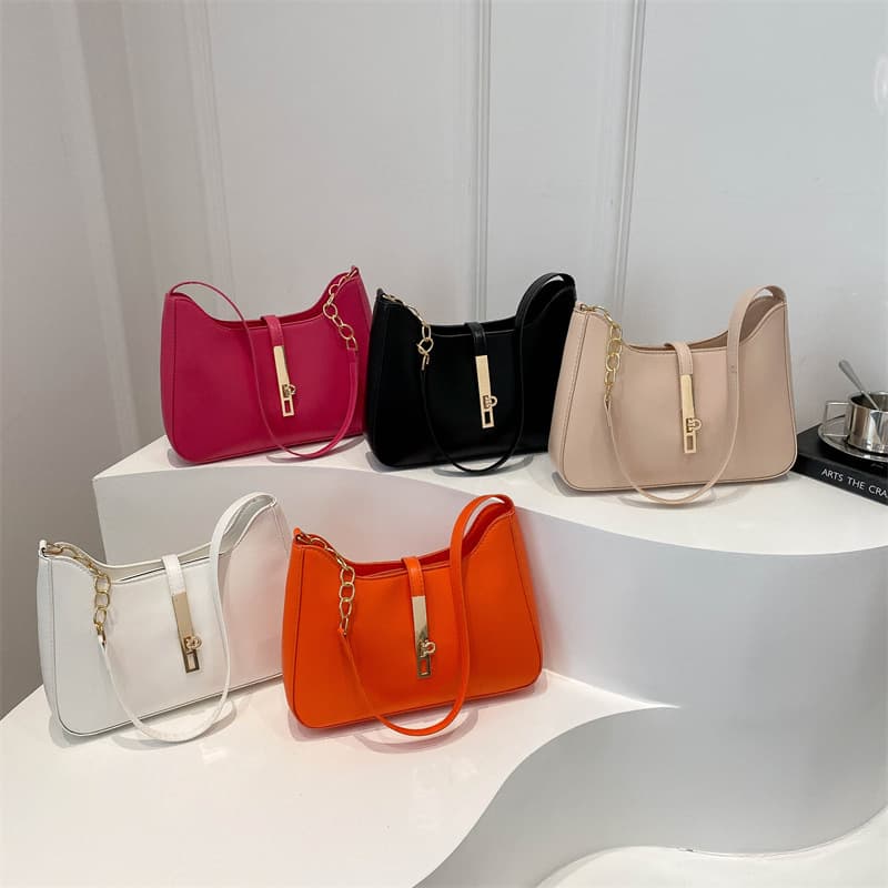 New trendy and beautiful portable solid color bag fashion this year's popular niche design bag women's shoulder bag armpit bag