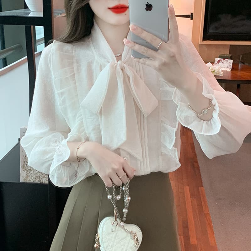 Real photos of a chiffon blouse with a French flair for spring, featuring a unique tie-up bow and a stylish design.