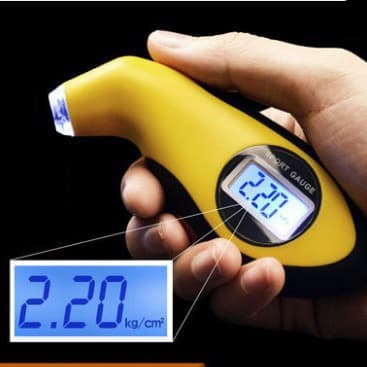 Vehicle-mounted high-precision tire pressure monitoring gauge with digital display and indicator light.