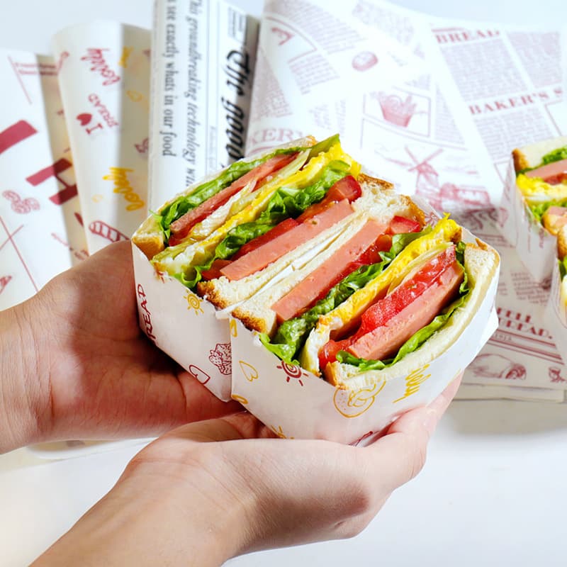 Oil-absorbing and oil-resistant sandwich and hamburger paper trays, bread baking plates, placemats, cuttable commercial sandwich wrapping paper