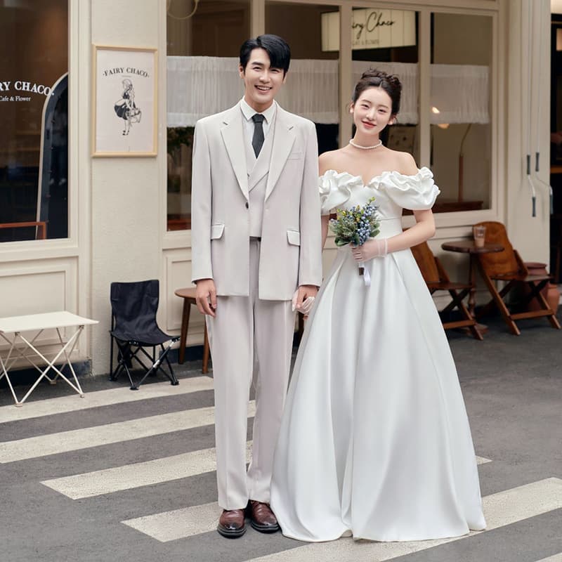 French-style lightweight wedding dress for bridal travel photography, satin outdoor gown, ethereal white simple one-shoulder welcome dress