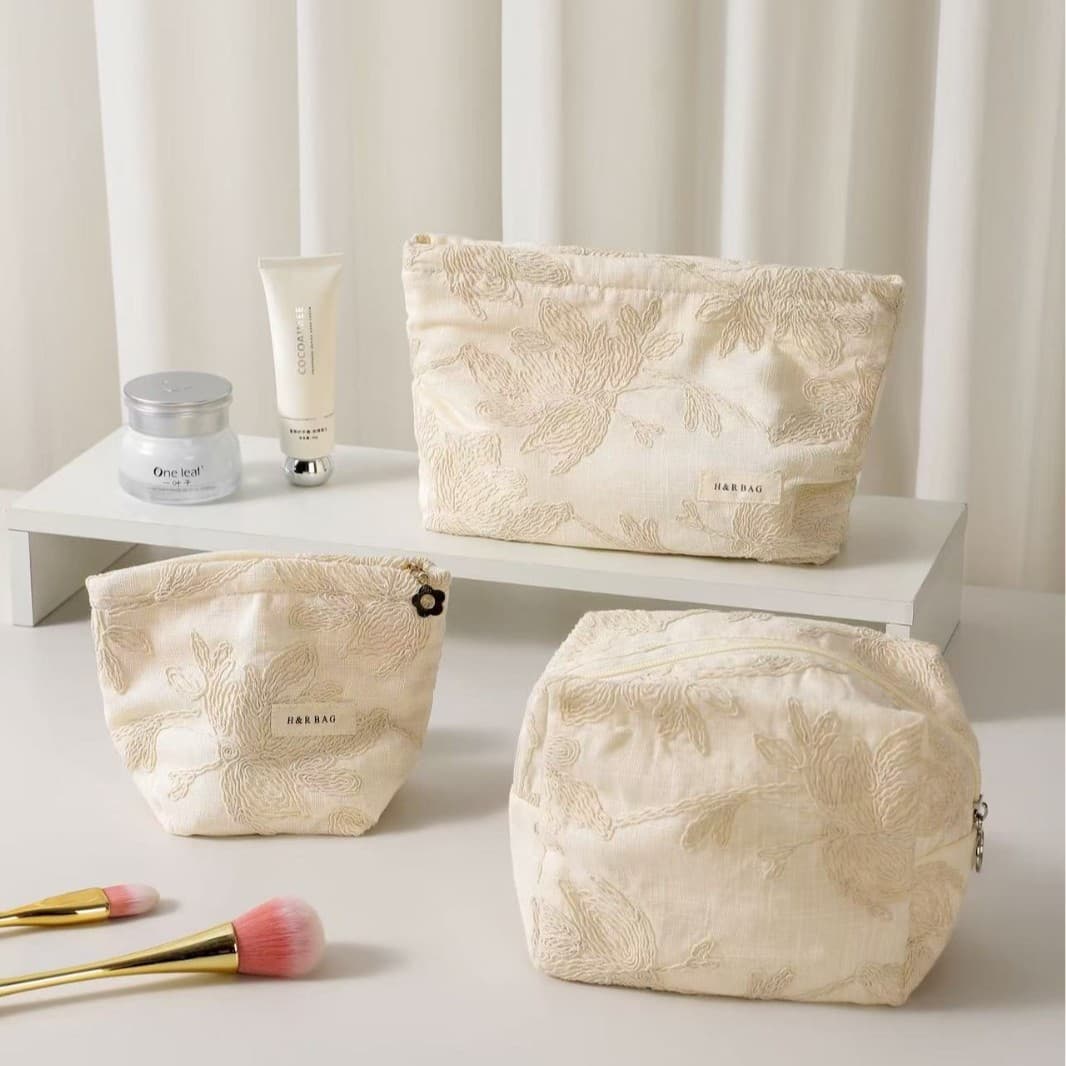 French exquisite high-end cotton and linen embroidery women's hand cosmetic bag portable travel storage bag pillow bag