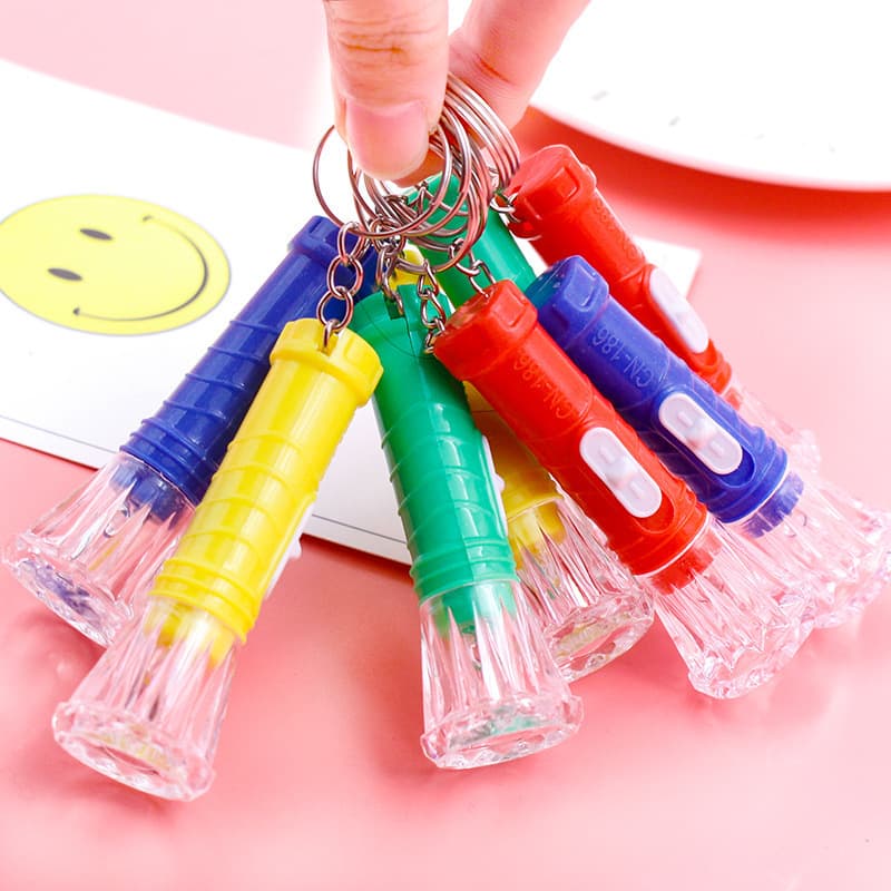 Transparent mini toy flashlight, electronic light-up portable flashlight, children's prize keychain pendant, small gift