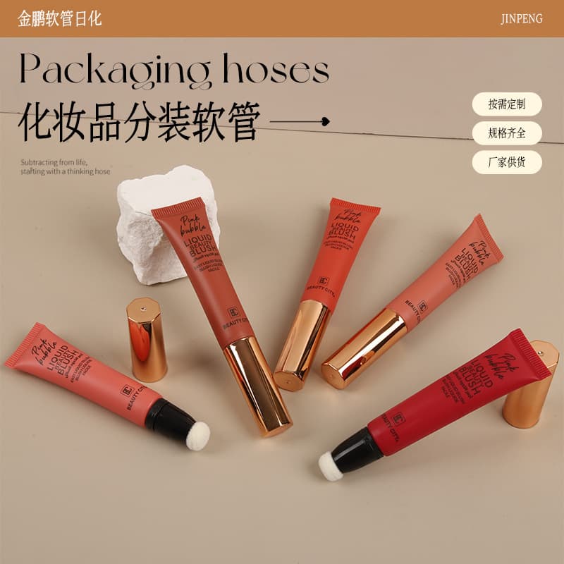 Wholesale of plastic cosmetic tubes, including lip balm, ointment, serum, eye cream, and skincare products with brush heads.